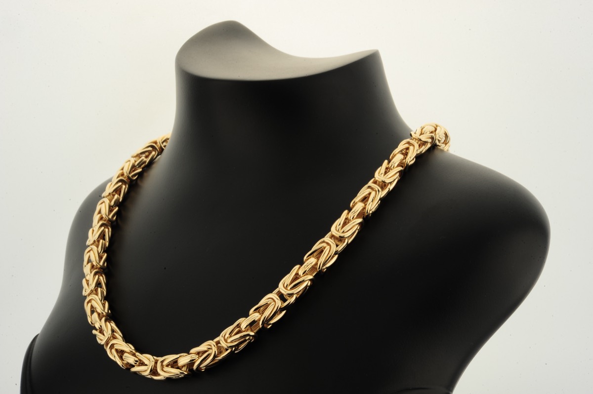 Byzantine gold chain on a black display bust